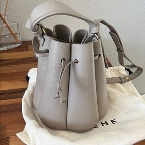 Polène Taupe Gray Pebbled Leather Bucket Bag with Drawstring
